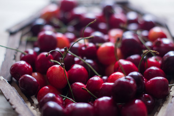 Cherry berries are fresh on a wooden background. Concept of health.