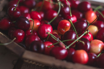 Cherry berries are fresh on a wooden background. Concept of health.