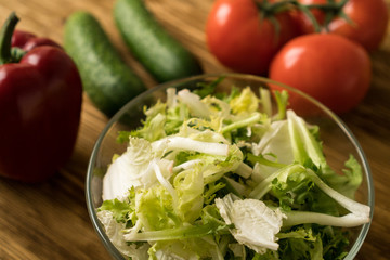 Salad ingridients. Tomato, lettuce, paprika and cucumber.