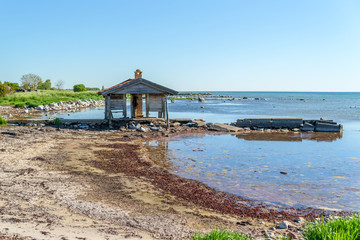Small and abandoned boathouse and pier. Time and weather has been tough on this place. Ossby in southern Oland, Sweden.
