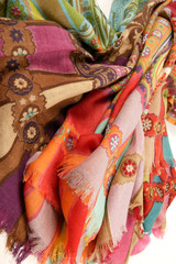 Fototapeta premium Still life of colorful scarves, draped on table, isolated neckerchief, Women Accessories