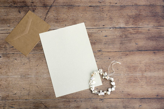 Blank white greeting card with brown envelop
