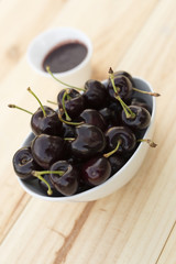 White bolw  with ripe cherries