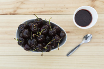 White bolw  with ripe cherries