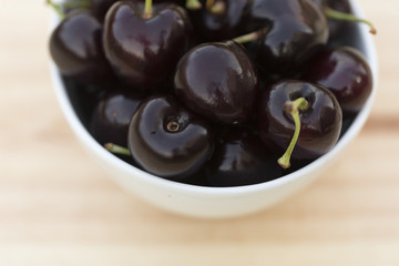 White bolw  with ripe cherries