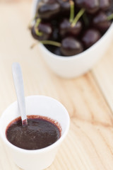 White bolw  with ripe cherries