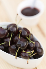 White bolw  with ripe cherries
