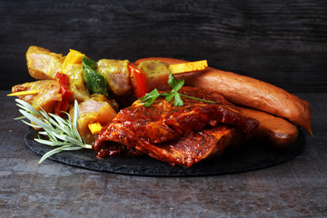 Selection of marinaded meat for bbq grilling with herbs on table