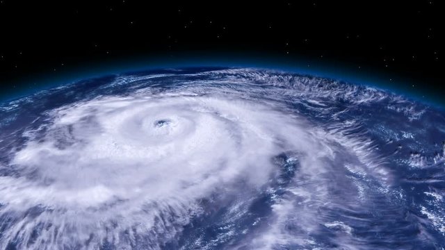 Hurricane storm tornado over the Earth from space, satellite view.