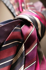 Colorful ties draped on table
