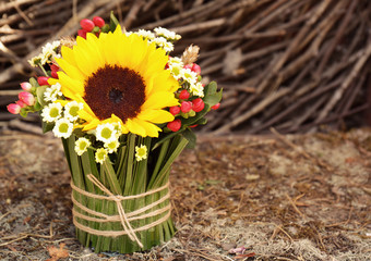 Beautiful bouquet with sunflower on blurred background