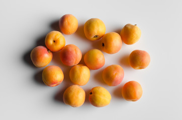 Multiple Apricots on White Background