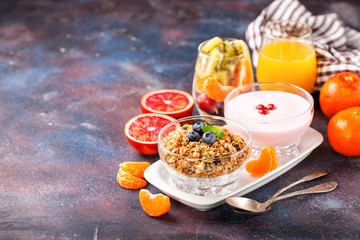 Healthy breakfast - muesli, yogurt and fruits. Selective focus. Copy space. Top view