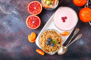 Healthy breakfast - muesli, yogurt and fruits. Selective focus. Copy space. Top view