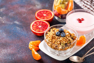 Healthy breakfast - muesli, yogurt and fruits. Selective focus. Copy space. Top view
