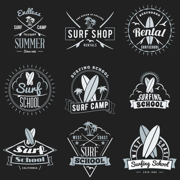 Set of summer surfing school, surfboard rentals and camping promotional emblem design. Typographic retro style summer advertising badges for banner or poster. Isolated on black. Vector illustration