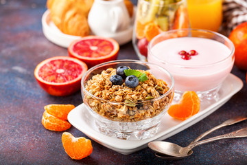 Healthy breakfast - muesli, yogurt and fruits. Selective focus. Copy space. Top view