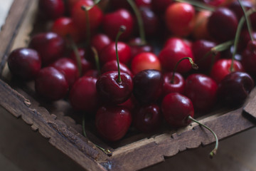 Cherry berries are fresh on a wooden background. Concept of health.
