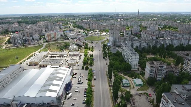 Splendid view on Kherson city in  Ukraine from bird`s eye perspective with multistoreyed apartment blocks, green streets, wide highway, in a sunny day in summer. The cityscape looks fine