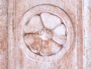Architectural elements of the facade, vintage wall texture rosette.