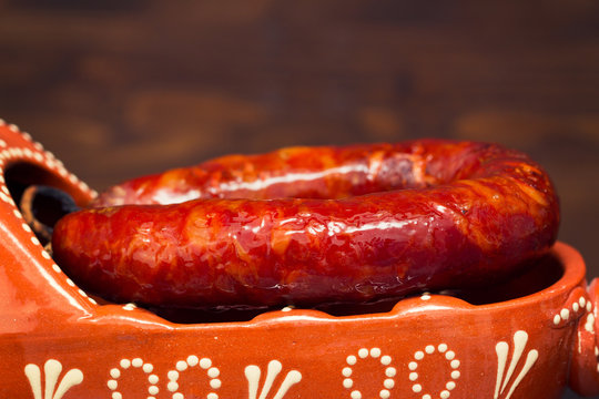 typical smoked portuguese sausage in ceramic dish