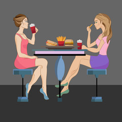 Two women eating fast food on dark background