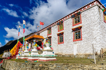 View on traditional tibetan house with prayer flags