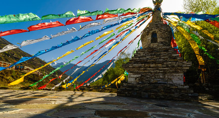 View on tibetan Stupa with colorful buddhist prayer flags