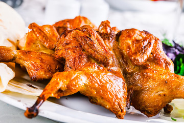 Grilled chicken on white plate