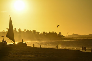 Sunset at Cumbuco Beach. Kite surfers on the sea, Ceara State, Brazil