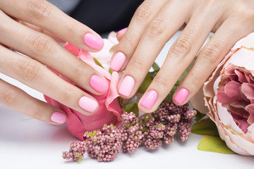 Women's hands and amazing natural nails. Ideal manicure with gel polish and nail art.