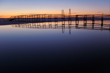 Wooden pedestrian bridge over the river