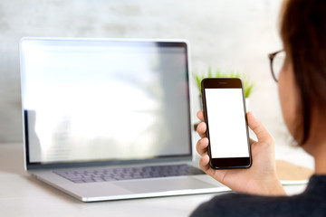 woman holding and looking on phone mobile white screen