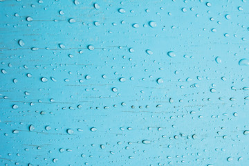The blue background with small drops
