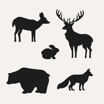 Animal silhouettes on white background. Silhouettes of deer, hare, bear and fox. Vector illustration.