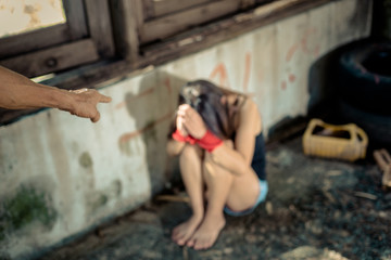 Woman bondage in angle of abandoned building ,focus blur. stop violence against Women, international women's day