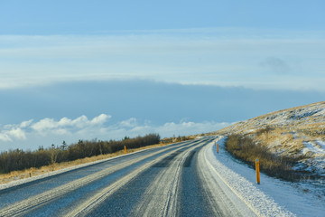 Empty road with an ocean view in winter season in Iceland