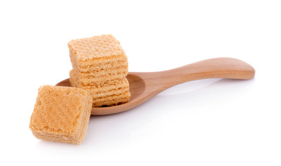 Milk wafers cubes on spoon isolated