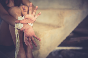 Woman bondage in angle of abandoned building image blur , stop violence against Women,...