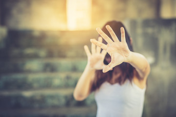 Woman bondage in angle of abandoned building image blur , stop violence against Women, international women's day