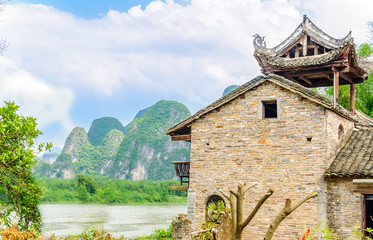 Fototapeta na wymiar Traditional chines house in karst landscape by Yangshuo - China