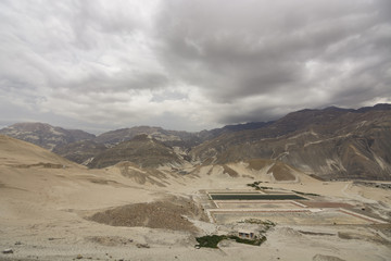 Water basins on the step slopes of the canyon in Moquegua Region, Peru. South America