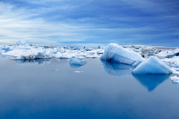 Fototapeta na wymiar Blue Icebergs in Glacier Lagoon, Jokulsarlon, Iceland