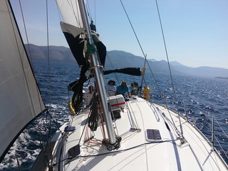 yacht sailing heeled over at an angle in the sea