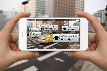 Augmented reality in marketing. Phone in hand, on screen information guide about shopping and entertainment spaces in real time