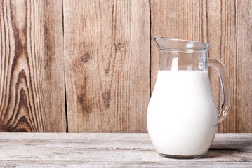 Milk in a jar on an old table