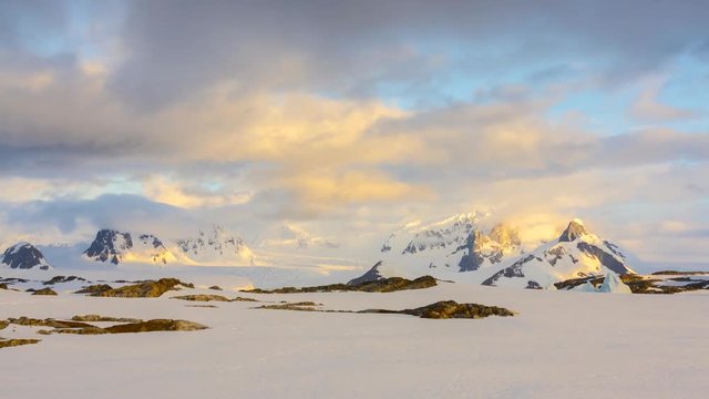 Time lapse sunset in Antarctica. Mountains and alpine glow.