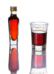 Alcohol shots and little bottle isolated on white background