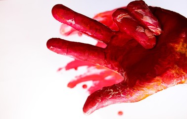 Hand in paint of different colors. A sign from several fingers.
