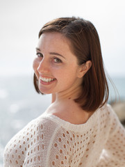 Young woman looking at camera smiling
